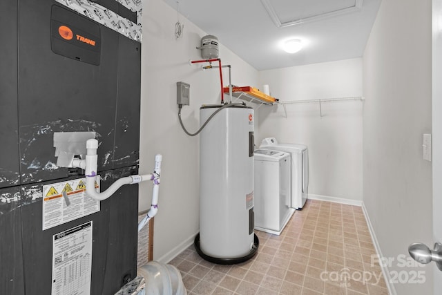 laundry area with electric water heater, baseboards, laundry area, heating unit, and independent washer and dryer