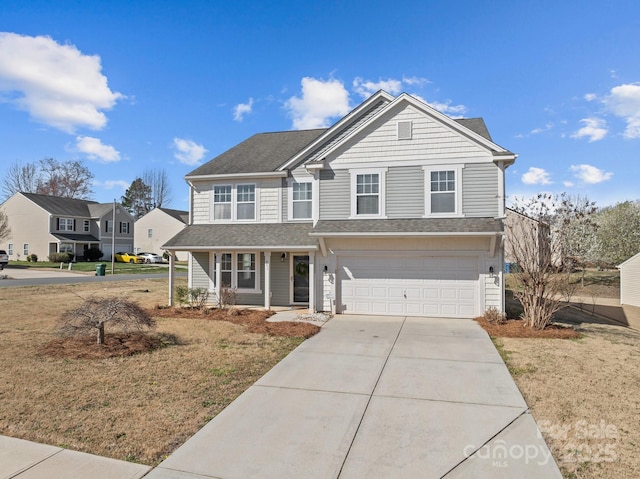 traditional home featuring a garage, roof with shingles, and concrete driveway