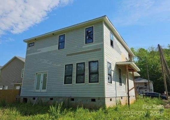 back of house with crawl space