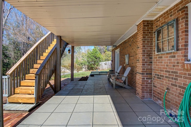 view of patio / terrace featuring stairs
