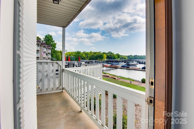 balcony featuring a water view