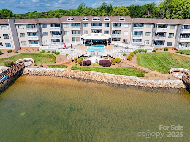 birds eye view of property with a water view