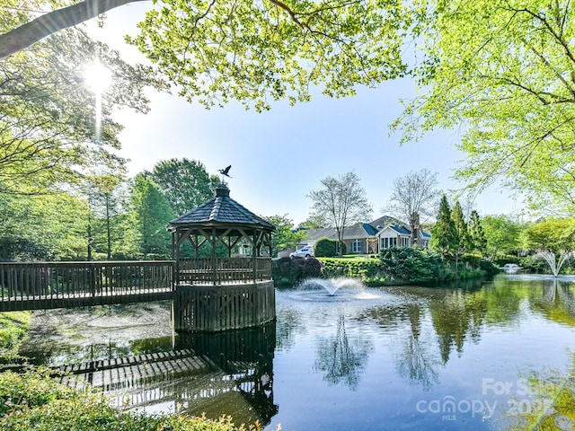 view of home's community featuring a gazebo and a water view