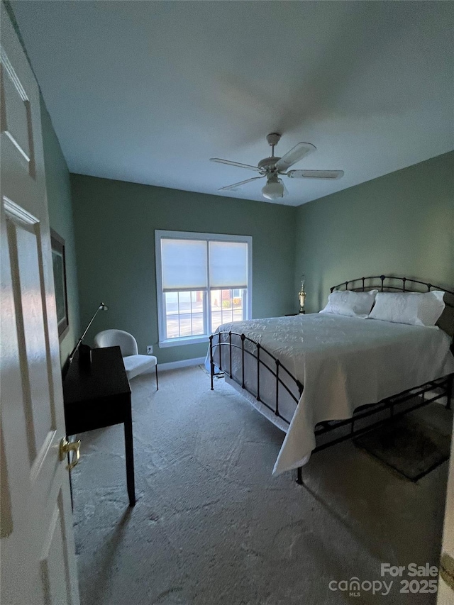 carpeted bedroom with a ceiling fan