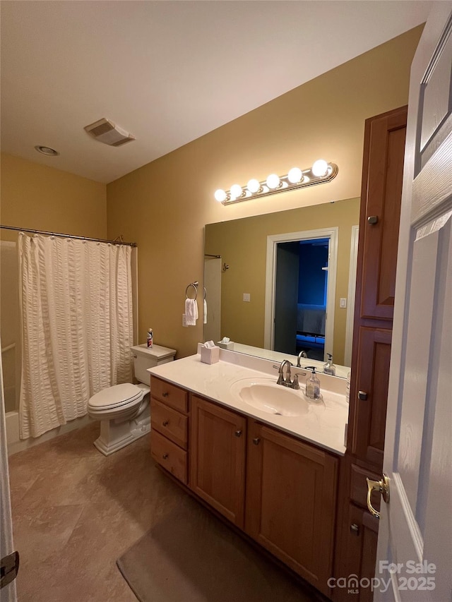 full bathroom with visible vents, toilet, and vanity