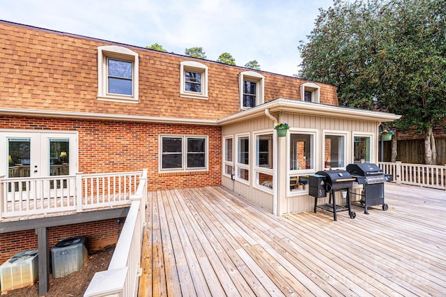 wooden deck featuring grilling area