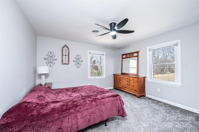 bedroom featuring visible vents, ceiling fan, baseboards, and carpet floors