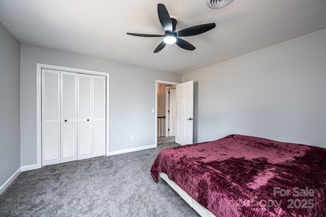 bedroom with visible vents, baseboards, carpet flooring, a closet, and a ceiling fan