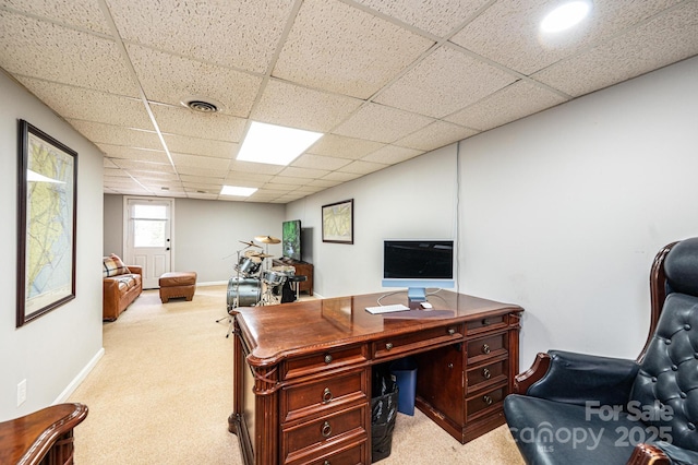 office area with light carpet, visible vents, a paneled ceiling, and baseboards