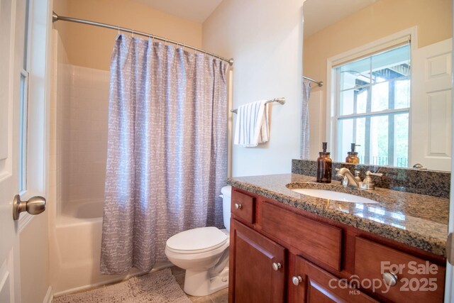 full bathroom with toilet, vanity, and shower / bathtub combination with curtain