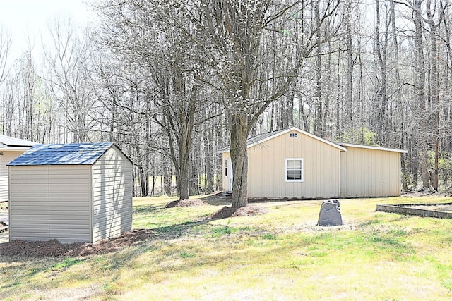 view of yard with a storage unit and an outdoor structure