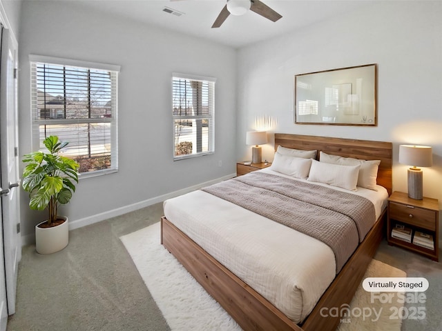 bedroom with visible vents, multiple windows, carpet, and baseboards