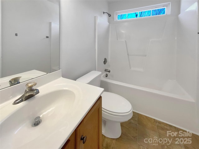 bathroom with bathing tub / shower combination, toilet, vanity, and tile patterned flooring