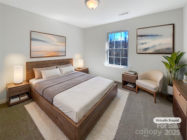 bedroom featuring visible vents, baseboards, and carpet floors