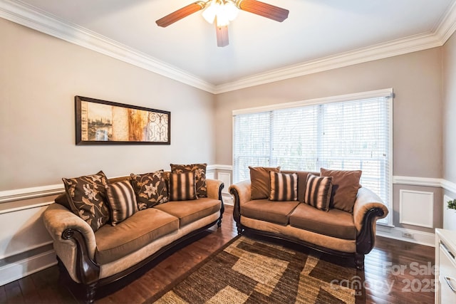 living area featuring plenty of natural light, dark wood-type flooring, and a ceiling fan