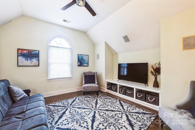 living room with visible vents, baseboards, lofted ceiling, dark wood-style floors, and a ceiling fan