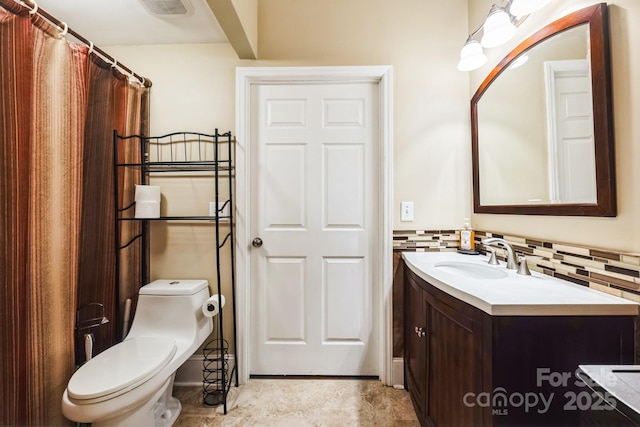 bathroom featuring vanity, toilet, tasteful backsplash, and visible vents