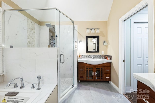 bathroom featuring vanity, a shower stall, and a bath