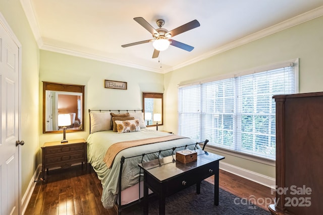 bedroom featuring dark wood finished floors, crown molding, a ceiling fan, and baseboards