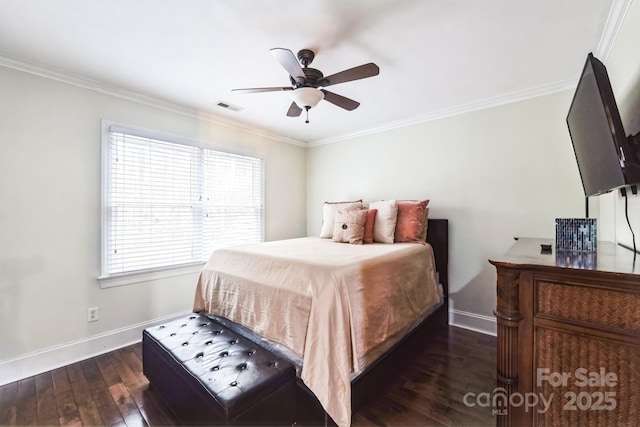 bedroom with hardwood / wood-style floors, a ceiling fan, baseboards, visible vents, and ornamental molding