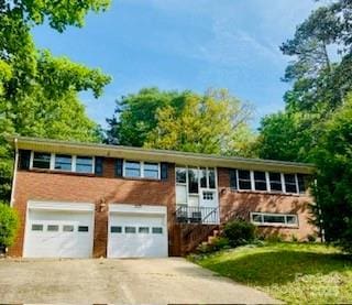 1525 16th Avenue Cir NW, Hickory, NC 28601 - split foyer home with a garage and concrete driveway