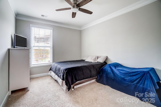 bedroom featuring visible vents, baseboards, carpet, and crown molding