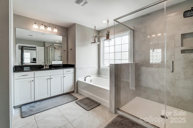 full bath featuring visible vents, a garden tub, a shower stall, tile patterned flooring, and vanity