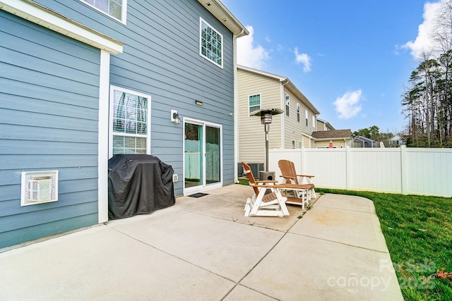 view of patio / terrace featuring grilling area and fence