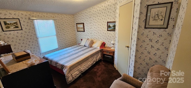 bedroom featuring a textured ceiling, carpet, and wallpapered walls