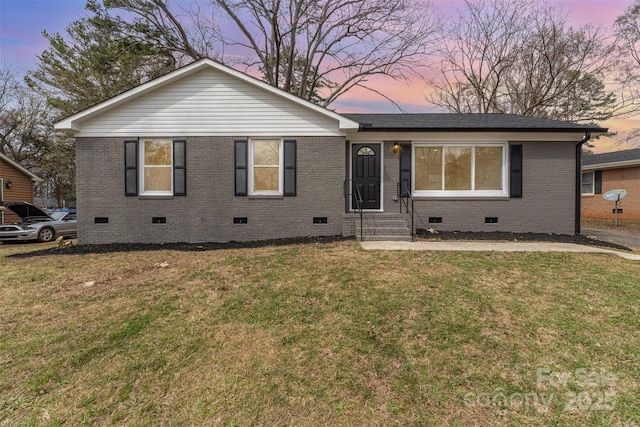 single story home with a front yard, brick siding, and crawl space