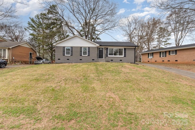 view of front of property with a front lawn, brick siding, and crawl space