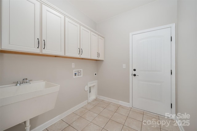 clothes washing area with hookup for a washing machine, light tile patterned floors, hookup for an electric dryer, cabinet space, and a sink