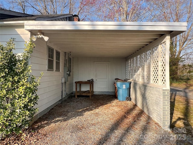 view of car parking featuring an attached carport