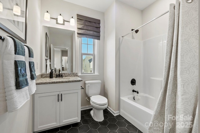 full bath with toilet, shower / bath combination with curtain, tile patterned flooring, baseboards, and vanity