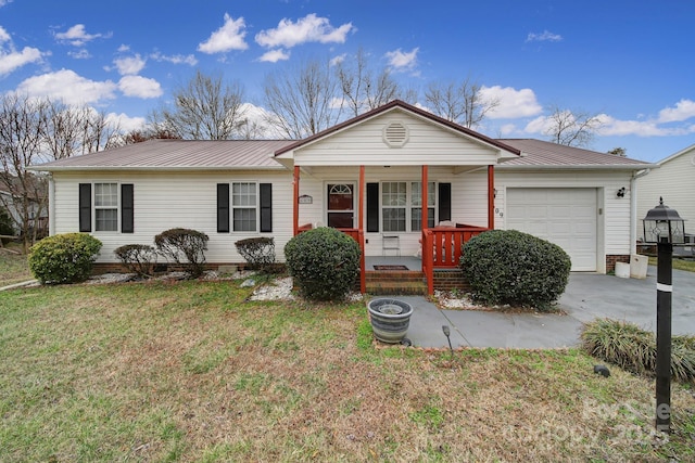 ranch-style house with driveway, covered porch, a front lawn, a garage, and metal roof