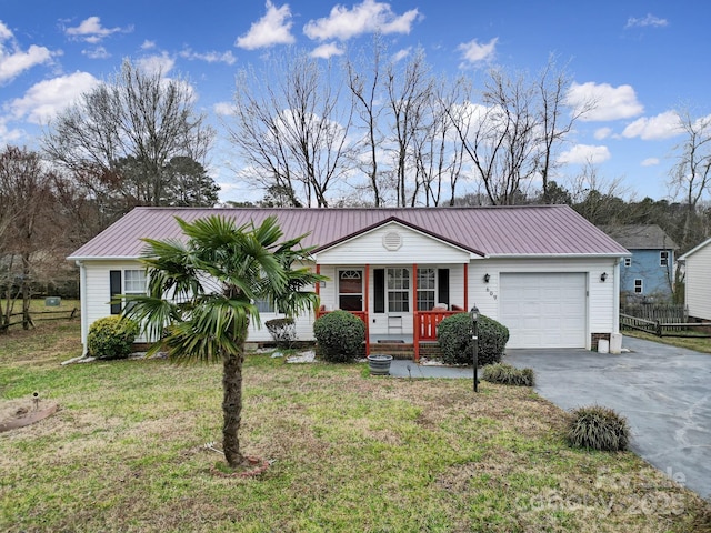 single story home featuring a porch, concrete driveway, a front yard, metal roof, and a garage