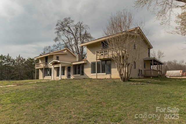 3607 Austin Rd, Monroe, NC 28112 - back of house featuring a balcony and a lawn
