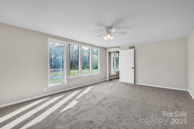 3607 Austin Rd, Monroe, NC 28112 - carpeted empty room with visible vents, baseboards, and a ceiling fan