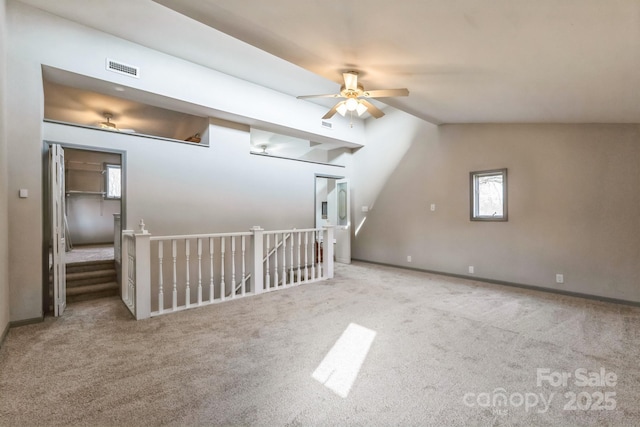 3607 Austin Rd, Monroe, NC 28112 - additional living space with visible vents, ceiling fan, carpet flooring, and vaulted ceiling