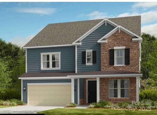 traditional home with brick siding, concrete driveway, an attached garage, and a shingled roof