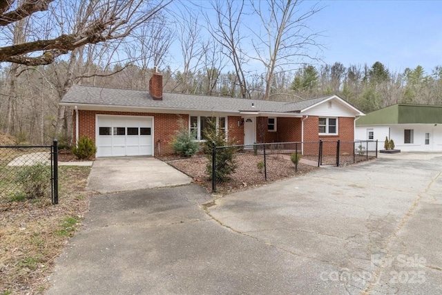 single story home featuring brick siding, an attached garage, a chimney, and fence