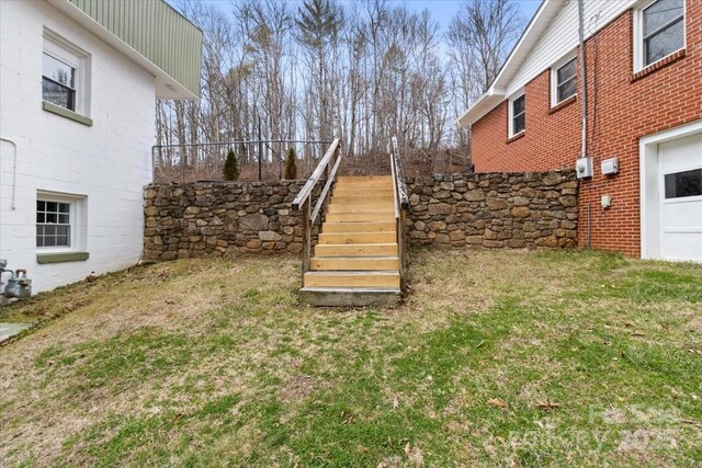 view of yard featuring stairway