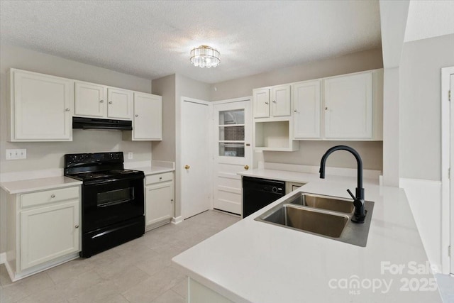 kitchen with black appliances, under cabinet range hood, a sink, a textured ceiling, and white cabinetry