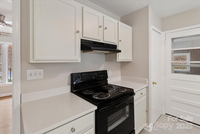 kitchen with black range with electric stovetop, under cabinet range hood, a textured ceiling, white cabinets, and light countertops