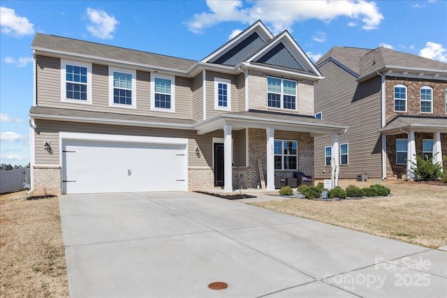 craftsman house with brick siding, a front lawn, covered porch, a garage, and driveway