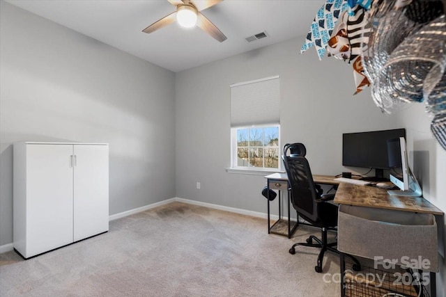 carpeted office space with a ceiling fan, visible vents, and baseboards