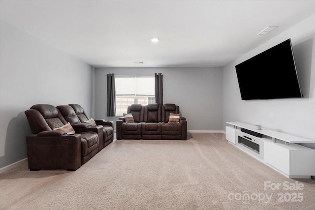 living room featuring visible vents, light colored carpet, and baseboards