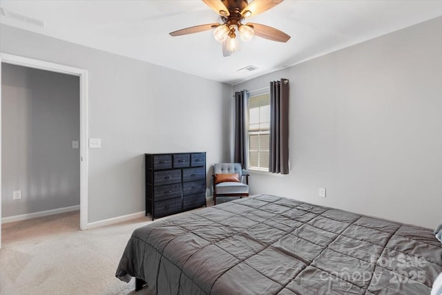 bedroom with baseboards, carpet floors, visible vents, and ceiling fan