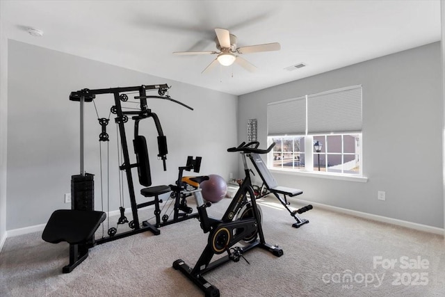 exercise room featuring visible vents, baseboards, ceiling fan, and carpet flooring