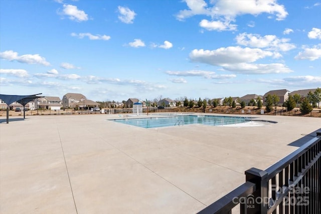 community pool featuring a patio area